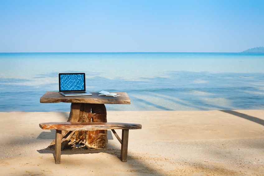 Sommerjob office on the beach, computer and table